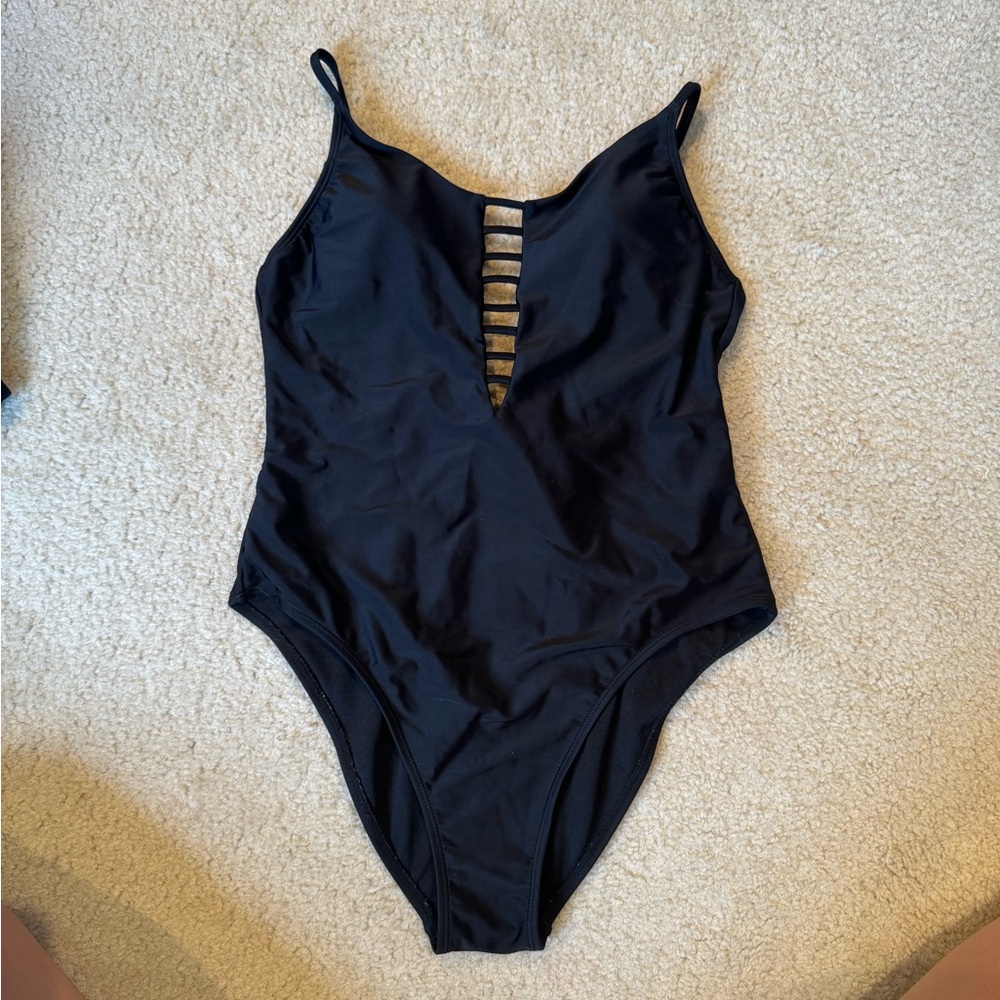 One piece swim suit with tie back. Size L